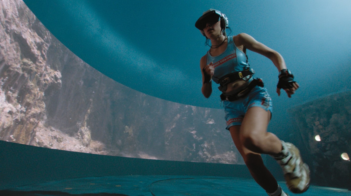 A player sprinting on the dish treadmill inside a wraparound world